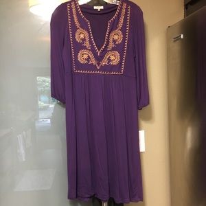 Fossil dress with embroidery on the front.